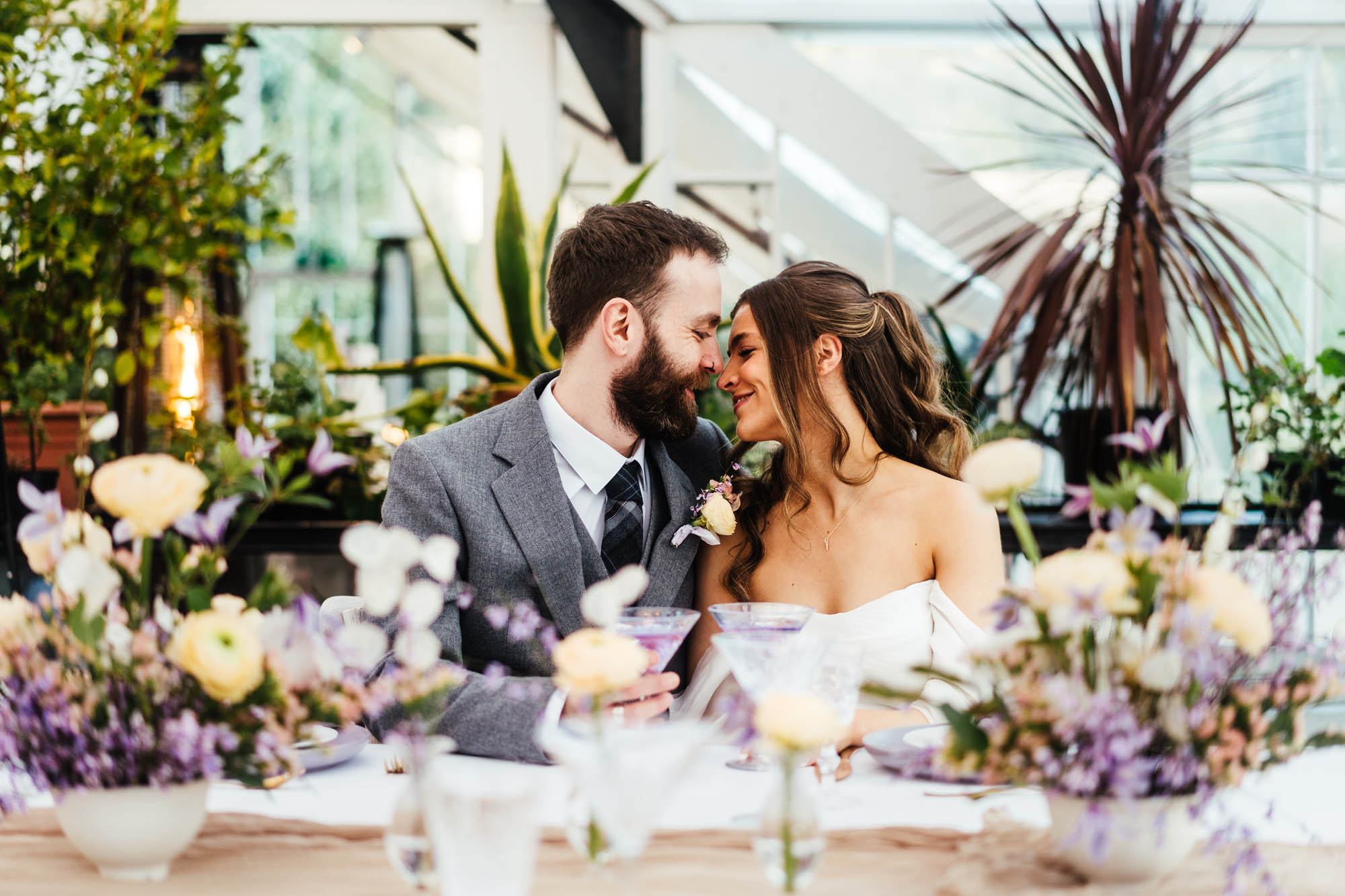 Groom and bride models at a wedding table, captured by Hannah Hall Photography at Glenapp