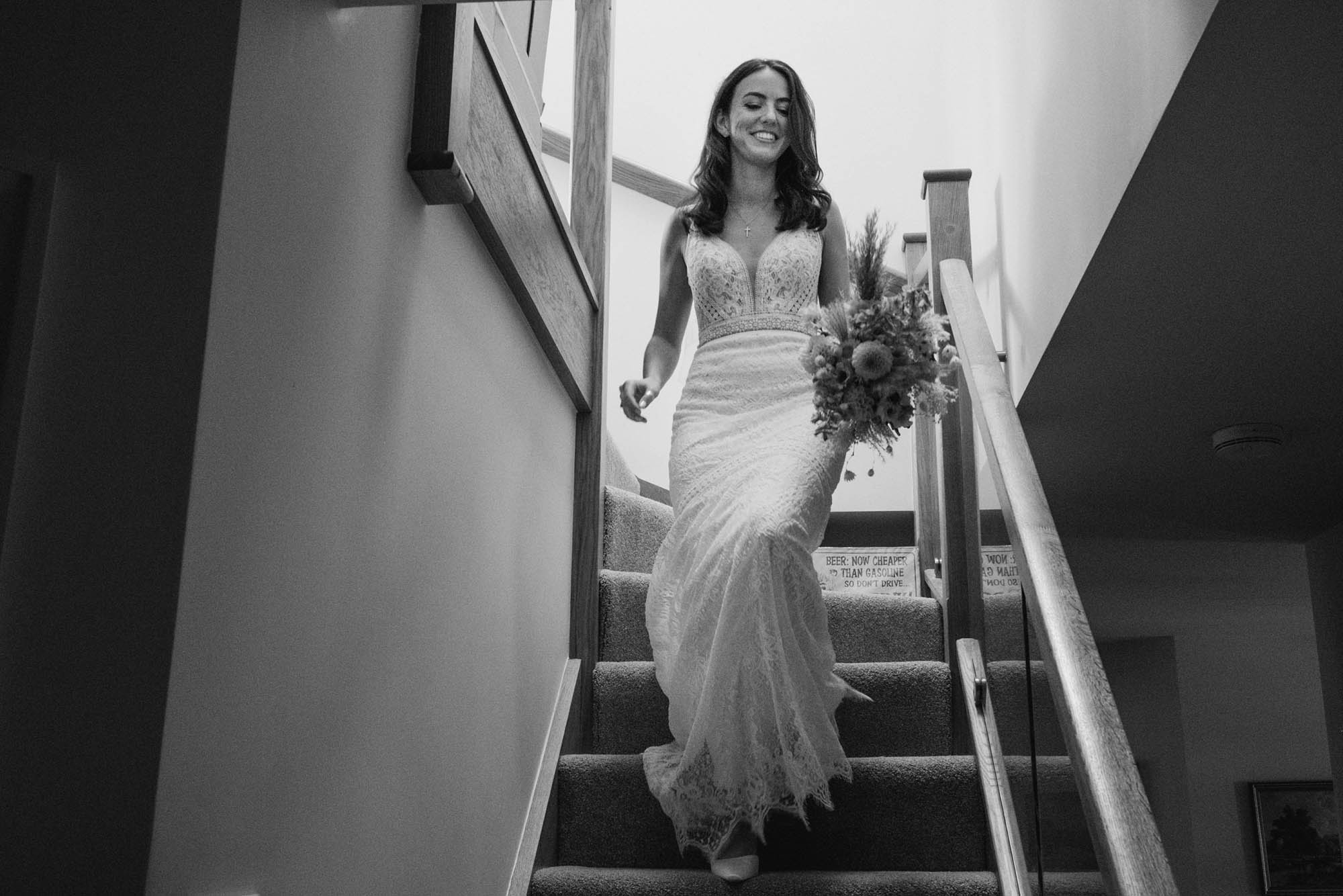 An authentic, unposed wedding image from High Billinghurst Farm with guests smiling Sophie and Chris's wedding day in Surrey. By wedding photographers and videographers York Place Studios