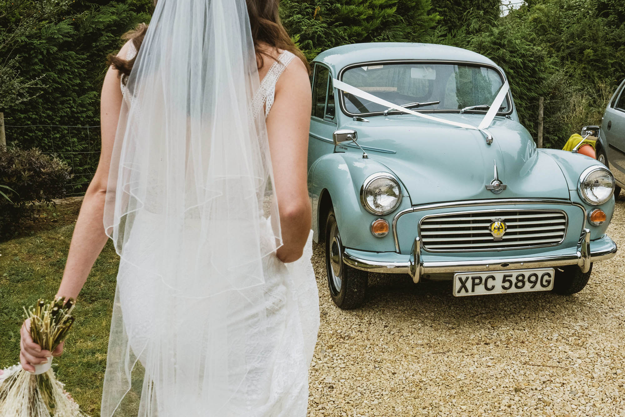 A natural wedding photo with guests enjoying Sophie and Chris's wedding day in Surrey. By York Place Studios who are London and UK award winning documentary photographers