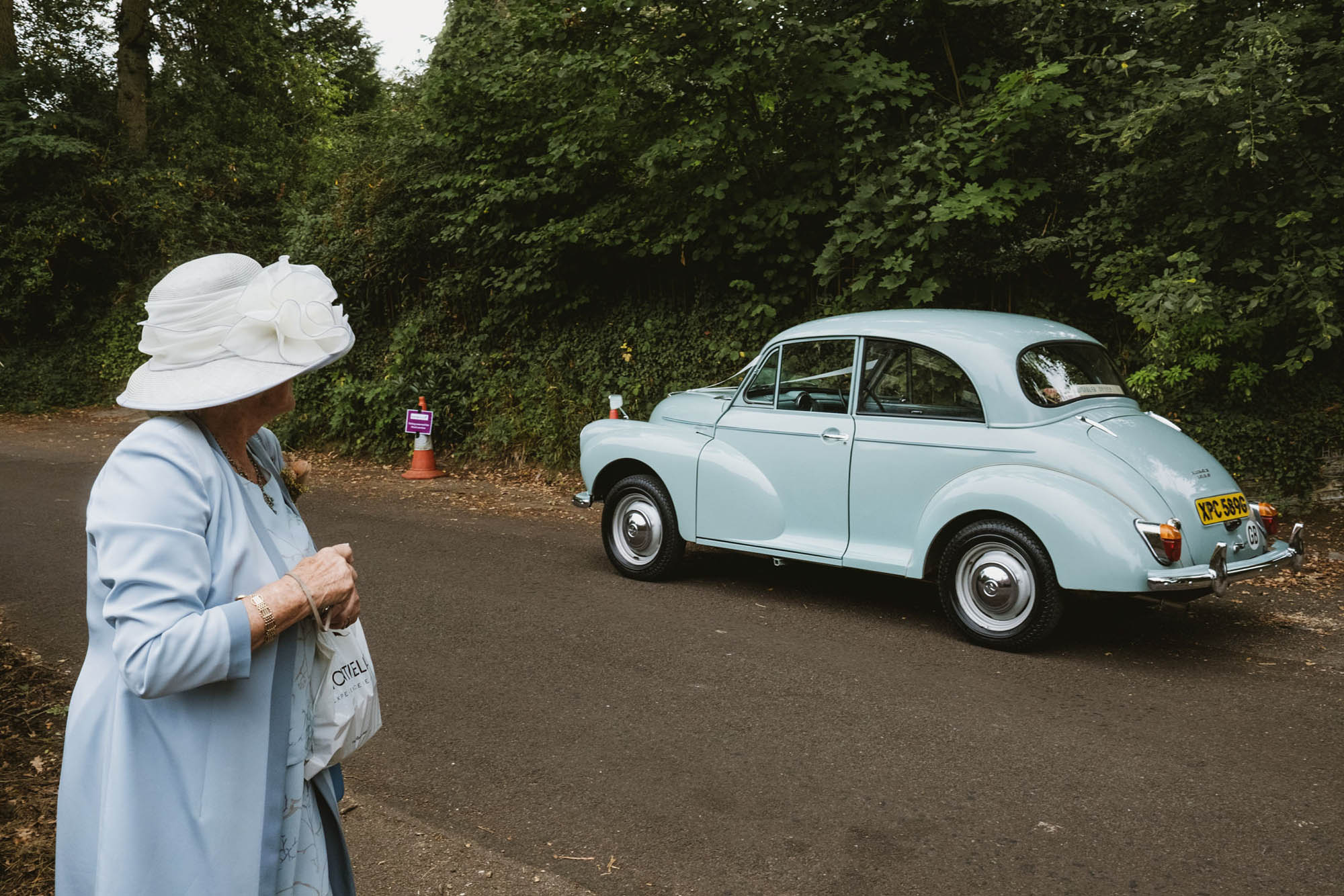 A natural wedding photo with guests enjoying Sophie and Chris's wedding day in Surrey. By York Place Studios who are London and UK award winning documentary photographers