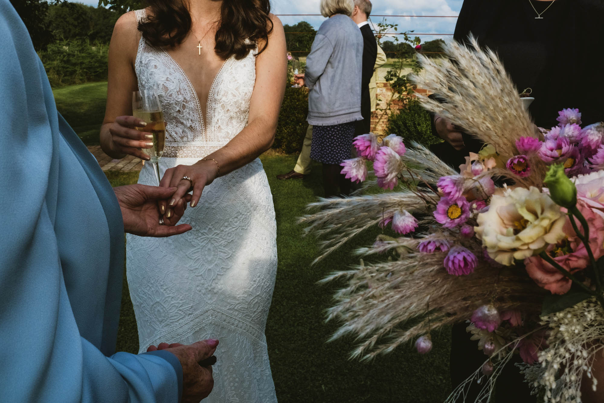An authentic unposed wedding image with guests enjoying Sophie and Chris's wedding day in Surrey. By York Place Studios who are London and UK documentary photographers