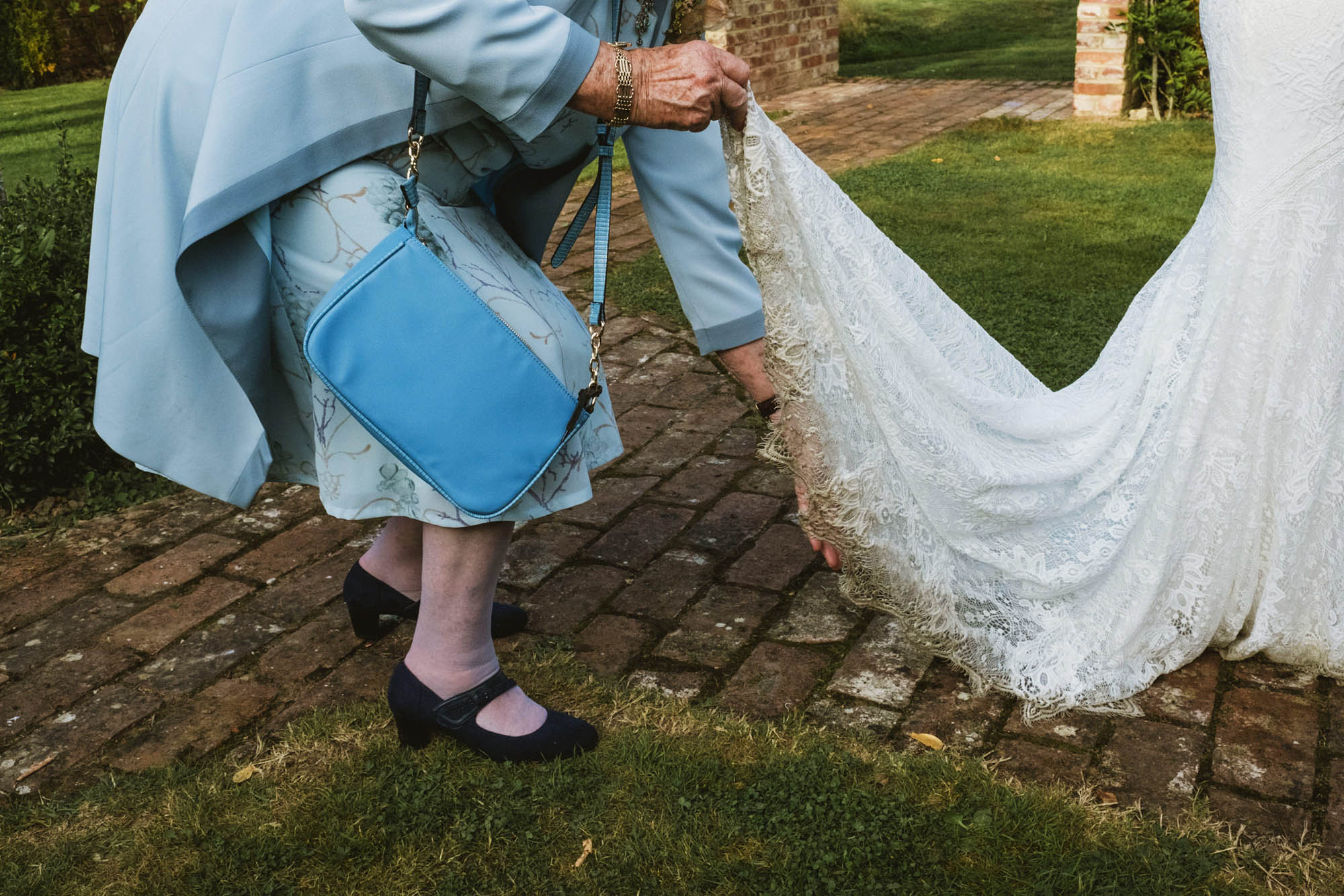 An authentic unposed wedding image with guests enjoying Sophie and Chris's wedding day in Surrey. By York Place Studios who are London and UK documentary photographers